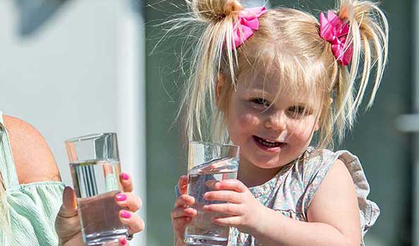 Girl with glass of water